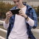Illustration for article titled Attractive Young Men Smiling at the PlayStation Vita